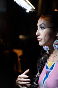 Photo of model Talaysay Campo owning the runway at the 2024 Vancouver Indigenous Fashion Week.